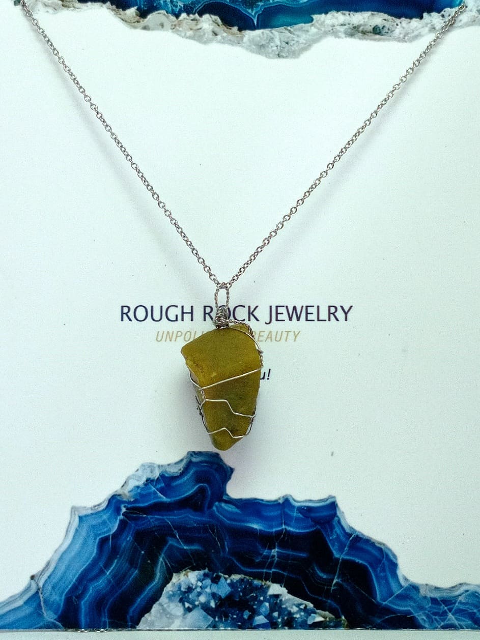 Necklace with a green opal pendant on a white and blue textured background, featuring 'Rough Rock Jewelry' text.