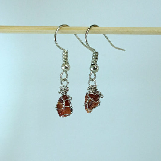 Garnet stones earrings with descriptive text on a white background