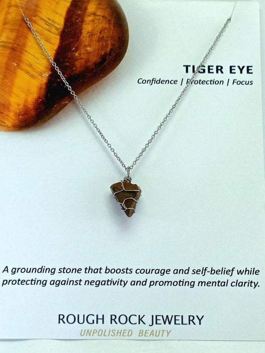 Tiger eye necklace on a white background with text about its properties and brand.