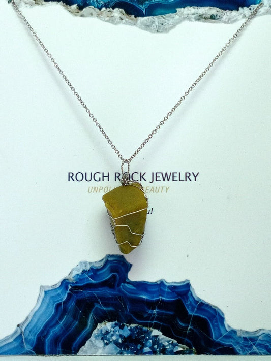 Necklace with a green opal pendant on a white and blue textured background, featuring 'Rough Rock Jewelry' text.