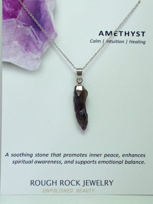 Amethyst pendant necklace on a card with text about its properties.