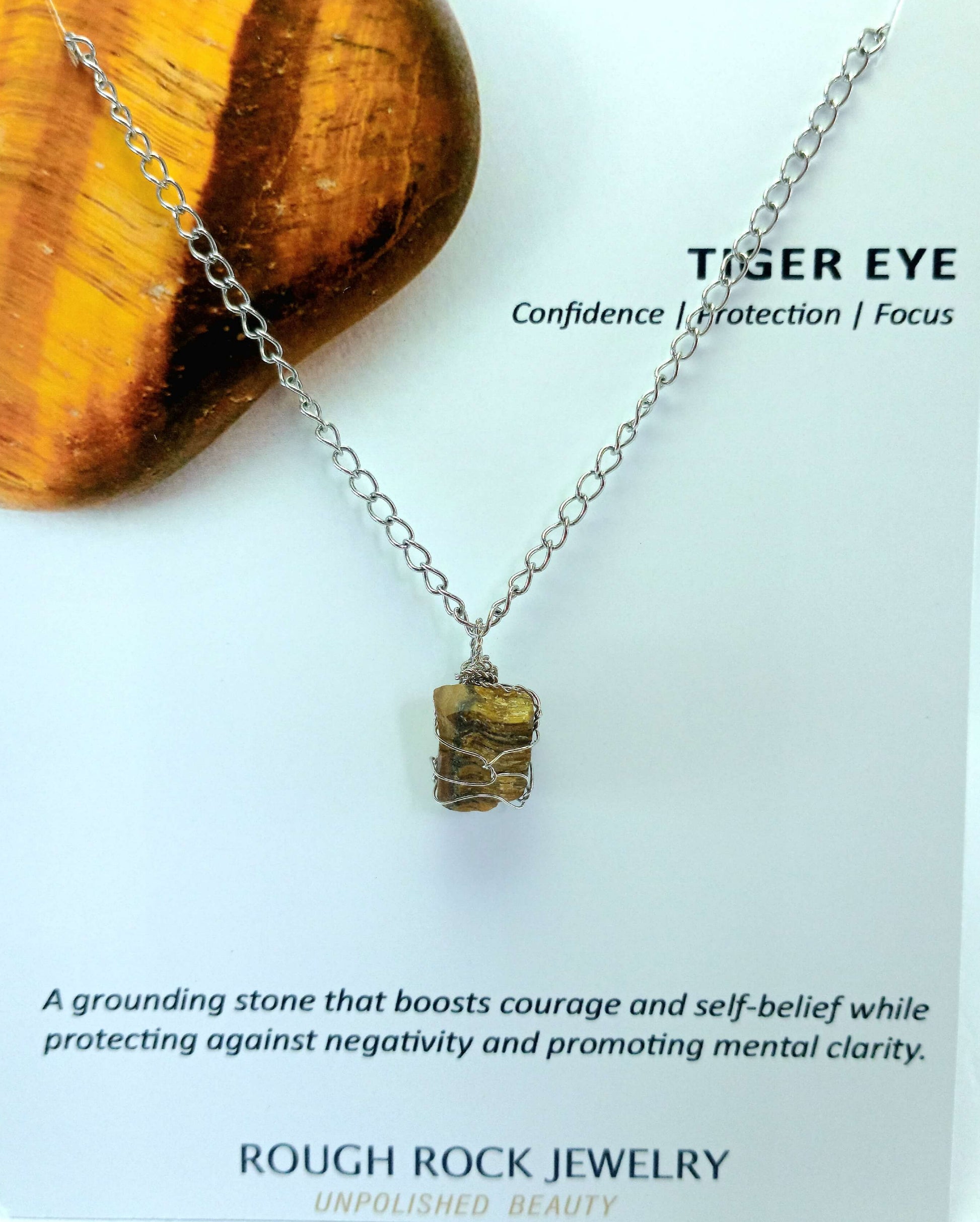 Tiger eye necklace on a card with stone and description