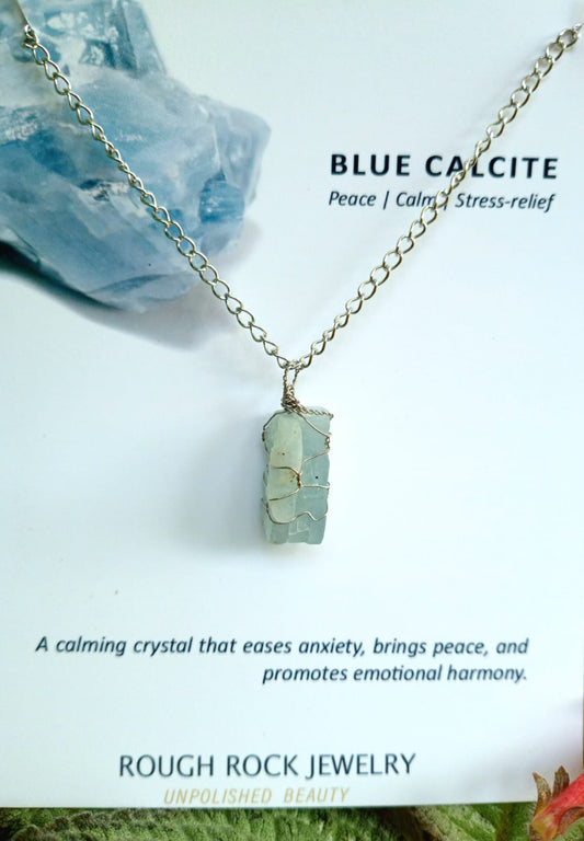 Blue calcite necklace with rough stone pendant on a white background, featuring text about its properties and brand.